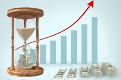 Currency flowing through hour glass and stack of dollar bills against graph bar in background Digital composition of currency flowing through hour glass and stack of dollar bills against graph bar in background
